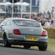 Illustration for article titled Derek Bell Hustles Bentley Continental Supersports Up Goodwood Hill Climb